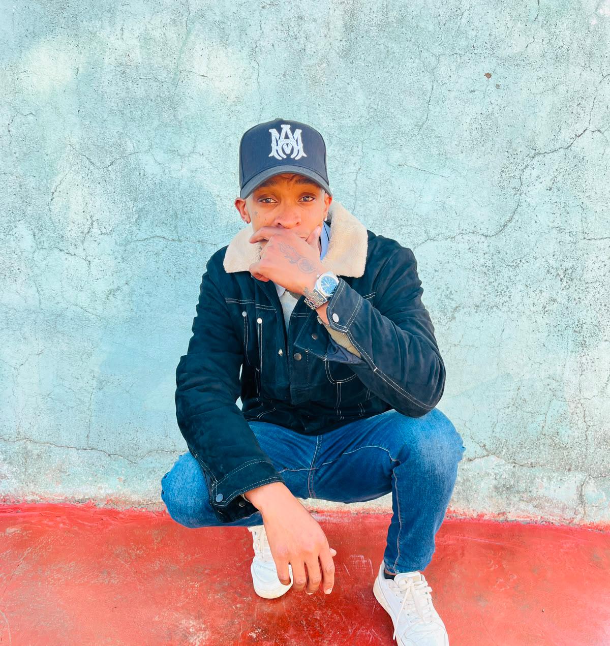 YungSavage QTN portrait against a textured teal wall